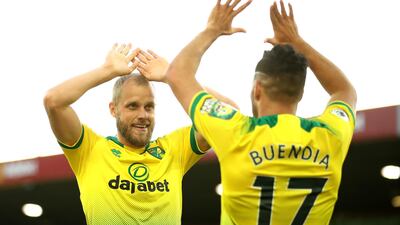 Teemu Pukki of Norwich City celebrates with teammate Emiliano Buendia after scoring his team's third goal. Getty Images