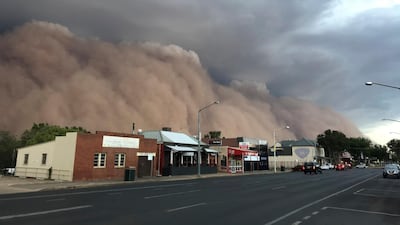 A dust cloud billows over a street in Dubbo, Australia, 400 kms west of Sydney. AP