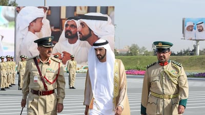 Sheikh Hamdan walks with Dr Ghaith Al Suwaidi, Director of Dubai Police Academy, and Dr Mohammed bin Fahd, Assistant Commander-in-chief of Dubai police for Academic and Training Affairs, while attending a police officer graduation ceremony at Dubai Police Academy. Wam