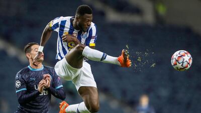 FC Porto's Portuguese defender Wilson Manafa vies with Marseille's French midfielder Valentin Rongier during the UEFA Champions League group C football match between FC Porto and Olympique Marseille at the Dragao stadium in Porto. AFP