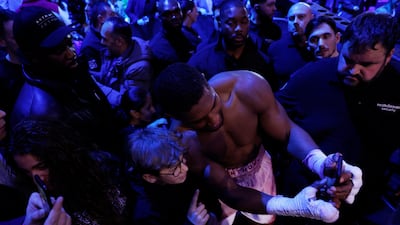 Anthony Joshua poses for a selfie with a fan after winning his fight against Jermaine Franklin. Reuters