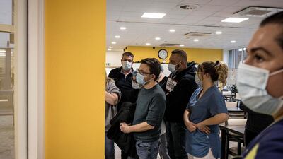 Nursing home workers wait their turn to be vaccinated with Pfizer-Biontech COVID-19 vaccines at the Ange-Raymond Gilles care home in Jemeppe-sur-Meuse, near Liege, Belgium. AP Photo