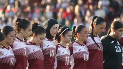 The Palestinian women's team stand for a minute's silence to commemorate Nakba Day, before the match in Dublin. PA