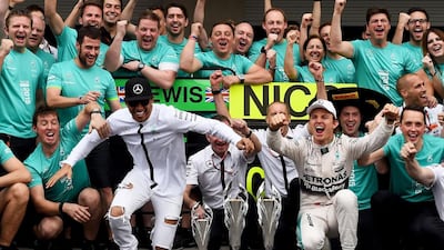 Lewis Hamilton, second from left, got off to a fast start over teammate, Nico Rosberg, right, and secured the 2015 Formula One drivers’ title in the United States. The Constructors’ title had been clinched in Russia at the previous race. Mercedes have 15 wins, 17 poles and 11 one-two finishes entering the finale at Abu Dhabi. Lars Baron / Getty Images