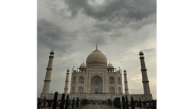 Moody skies shroud the magnificent Taj Mahal.