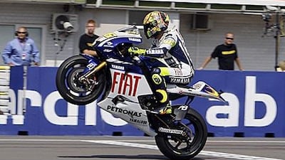 Yamaha's Valentino Rossi crosses the finish line to win the Czech Grand Prix at the Masaryk circuit in Brno.