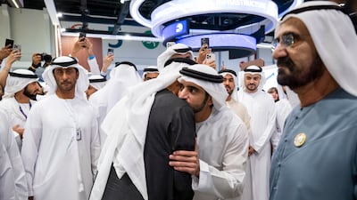 Sheikh Mohamed greets Sheikh Hamdan bin Mohammed, Crown Prince of Dubai, Deputy Prime Minister and Minister of Defence. Also pictured is Sheikh Mohammed, right