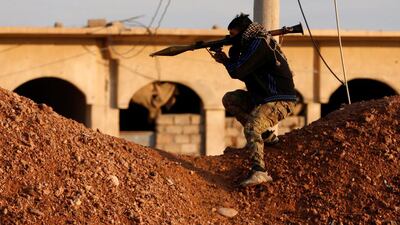 A member of the Iraqi army prepares to fire his rocket launcher during clashes with Islamic State militants.
