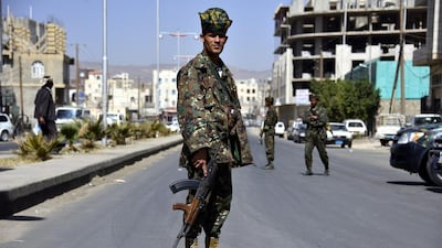 Yemeni soldiers stand guard in a street amid strict security measures in Sanaa on 23 February 2014 after authorities imposed strict security measures amid a continuing Al Qaeda insurgency and factional power struggles. Yahya Arhab / EPA