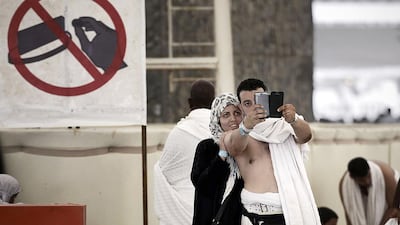 Muslim pilgrims pose for a selfie during the Jamarat ritual, the stoning of Satan, in Mina near Saudi Arabia’s holy city of Mecca. Mohammed Al Shaikh