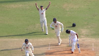 England players celebrate after Jack Leach bowls Rohit Sharma.