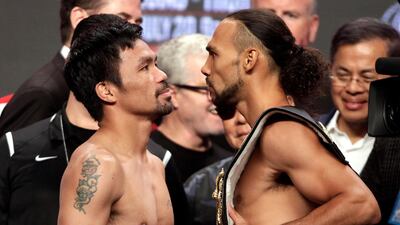 Manny Pacquiao and Keith Thurman face off during their weigh-in at the MGM Grand Hotel and Casino in Las Vegas. AFP
