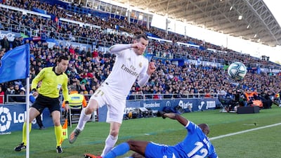 Getafe's defender Allan Nyom, right, fouls Real Madrid's Gareth Bale. EPA