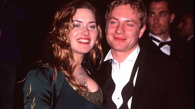 Kate Winslet, in a green Renaissance-inspired dress, and Jim Threapleton attend a 'Vanity Fair' party in Beverly Hills, California, on March 23, 1998. Getty Images