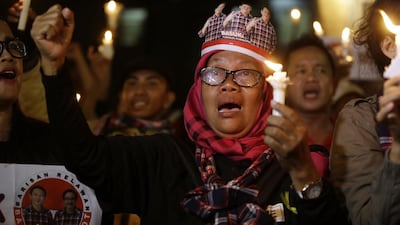 Supporters of former Jakarta governor Basuki "Ahok" Tjahaja Purnama – who was imprisoned for blasphemy against Islam – seen here protesting outside the high court in Jakarta, Indonesia on May 16, 2017. Achmad Ibrahim/AP Photo