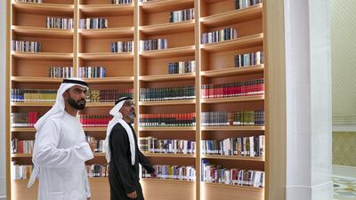 Maj Gen Sheikh Khaled bin Mohamed bin Zayed, Deputy National Security Adviser, right, and Saif Ghobash, Director General of Abu Dhabi Tourism and Culture Authority, tour the Library.