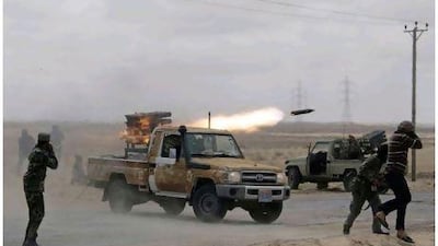 Libyan rebels fire rockets at troops loyal to Libyan leader Muammar Qaddafi on the road between Ajdabiya and Brega, Libya yesterday.