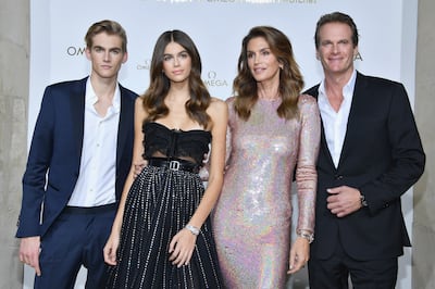 Presley Gerber, far left, with his sister Kaia, mother Cindy Crawford and father Rande Gerber. Getty Images