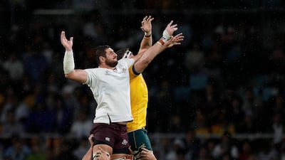 Georgia's Konstantine Mikautadze, left, and Izack Rodda of Australia fight for the ball at a line out. AFP
