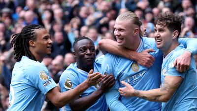 Erling Haaland of Manchester City celebrates with teammates after scoring his team's opening goal against Everton. Getty Images