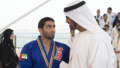 Sheikh Mohammed bin Zayed, Crown Prince of Abu Dhabi and Deputy Supreme Commander of the Armed Forces, with a player from the UAE team who took part in the Jiu-Jitsu World Championship. Rashed Al Mansoori / Crown Prince Court - Abu Dhabi
