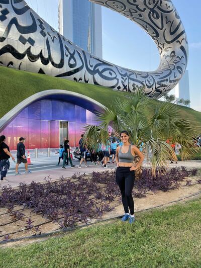 Janice Rodrigues makes a quick stop for a photo next to the Museum of the Future during the Dubai Run.