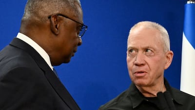 US Secretary of Defence Lloyd Austin, left, and Israel's Defence Minister Yoav Gallant speak in Tel Aviv on Monday. AFP