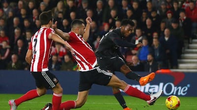 Daniel Sturridge of Liverpool shoots past Steven Caulker of Southampton to score their equalising first goal against Southampton on Wednesday night. Michael Steele / Getty Images