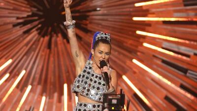 Host Miley Cyrus speaks. Matt Sayles / Invision / AP
