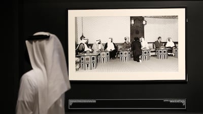 Queen Elizabeth II sits with Sheikh Zayed and Sheikh Rashid, as well as rulers of the other emirates. During this visit, she toured various cultural sites across the country, including Al Ain, Dubai Creek and the World Trade Centre. Chris Whiteoak / The National