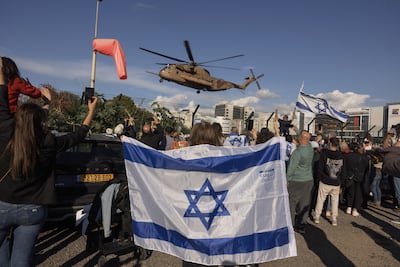 Crowds cheer outside the hospital where four Israeli hostages released on Saturday are being treated. Bloomberg