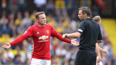 Wayne Rooney of Manchester United, left, argues with referee Michael Oliver during the Premier League match against Watford at Vicarage Road on September 18, 2016 in Watford, England. Richard Heathcote / Getty Images