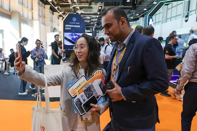 Visitors are seen at the Bitcoin Mena 2025 conference in Abu Dhabi. Victor Besa / The National