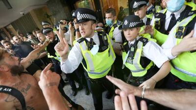 Police officers stop protesters from accessing Studioworks during the demonstration. Protesters gathered outside Studioworks to show their dismay against the BBC media bias. Getty Images