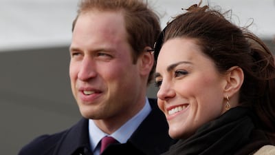 Kate Middleton and Prince William visit Trearddur Bay lifeboat station in Anglesey, Wales, in February 2011, after their engagement in November 2010