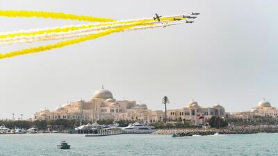 The Al Forsan Aerobatics team display the colours of the Vatican flag during the official ceremony to welcome Pope Francis at the Presidential Palace.