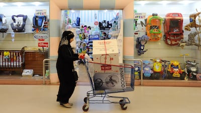 A shopper on the Cairo-Alexandria Desert Road near the Smart Village business park, Egypt, which has a Friday-Saturday weekend. Dana Smillie for The National