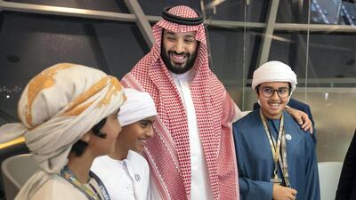 Prince Mohammed bin Salman (3rd L), stands for a photograph with Sheikh Zayed bin Abdullah bin Zayed (L), Sheikh Zayed bin Nahyan bin Zayed (2nd L), and Sheikh Mohamed bin Abdullah bin Zayed (4th L), at Shams Tower during the Formula 1 2018 Etihad Airways Abu Dhabi Grand Prix at Yas Marina Circuit. Ryan Carter / Ministry of Presidential Affairs
