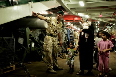 Royal Marines help British citizens off HMS Bulwark on July 21, 2006, in Limassol, Cyprus. Getty Images