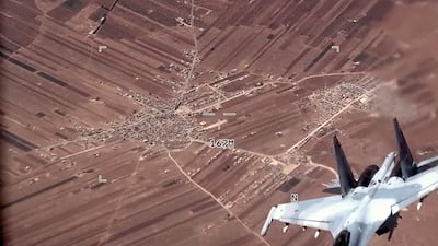 A Russian Su-35 flies near a US Air Force MQ-9 Reaper drone on July 5 over Syria. AP