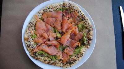 Salmon pizza at Market Kitchen. Courtesy Le Royal Meridien Abu Dhabi