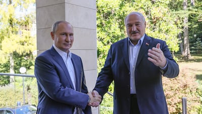 Russian President Vladimir Putin, left, shakes hands with Belarusian President Alexander Lukashenko in Sochi, Russia, on September 26. EPA