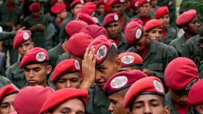 Members of the presidential guar line up to vote during presidential elections in Caracas, Venezuela. AP