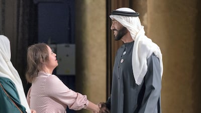 Sheikh Nahyan Bin Zayed, chairman of the Board of Trustees of Zayed bin Sultan Al Nahyan Charitable and Humanitarian Foundation, right, greets Special Olympics athlete, Mariam Azzab after a lecture by Loretta Claiborne. Ryan Carter / Ministry of Presidential Affairs