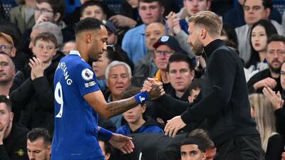 Pierre-Emerick Aubameyang shakes hands with Chelsea coach Graham Potter. AFP