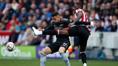 Arsenal's Gabriel Martinelli challenges Brentford's Ivan Toney. AP