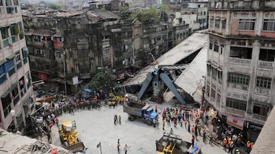National Disaster Response Force and Indian army personnel handle rubble after a bridge under construction collapsed in Kolkata. Piyal Adhikary / EPA