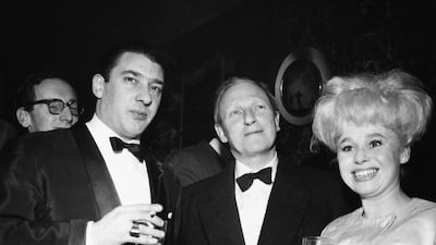 Portrait of actress Barbara Windsor with notorious East End gangster Ronnie Kray (left), London, circa 1960. Getty Images