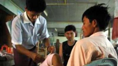 Athey, an ethnic Karen, lost his foot to a landmine in the Myanmar jungle and was taken to the Mae Tao Clinic Thailand for free treatment.