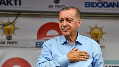 Turkish outgoing President and candidate Recep Tayyip Erdogan salutes party supporters during a rally on the eve of the elections in Istanbul, Turkey, on June 23, 2018. Aris Messinis / AFP